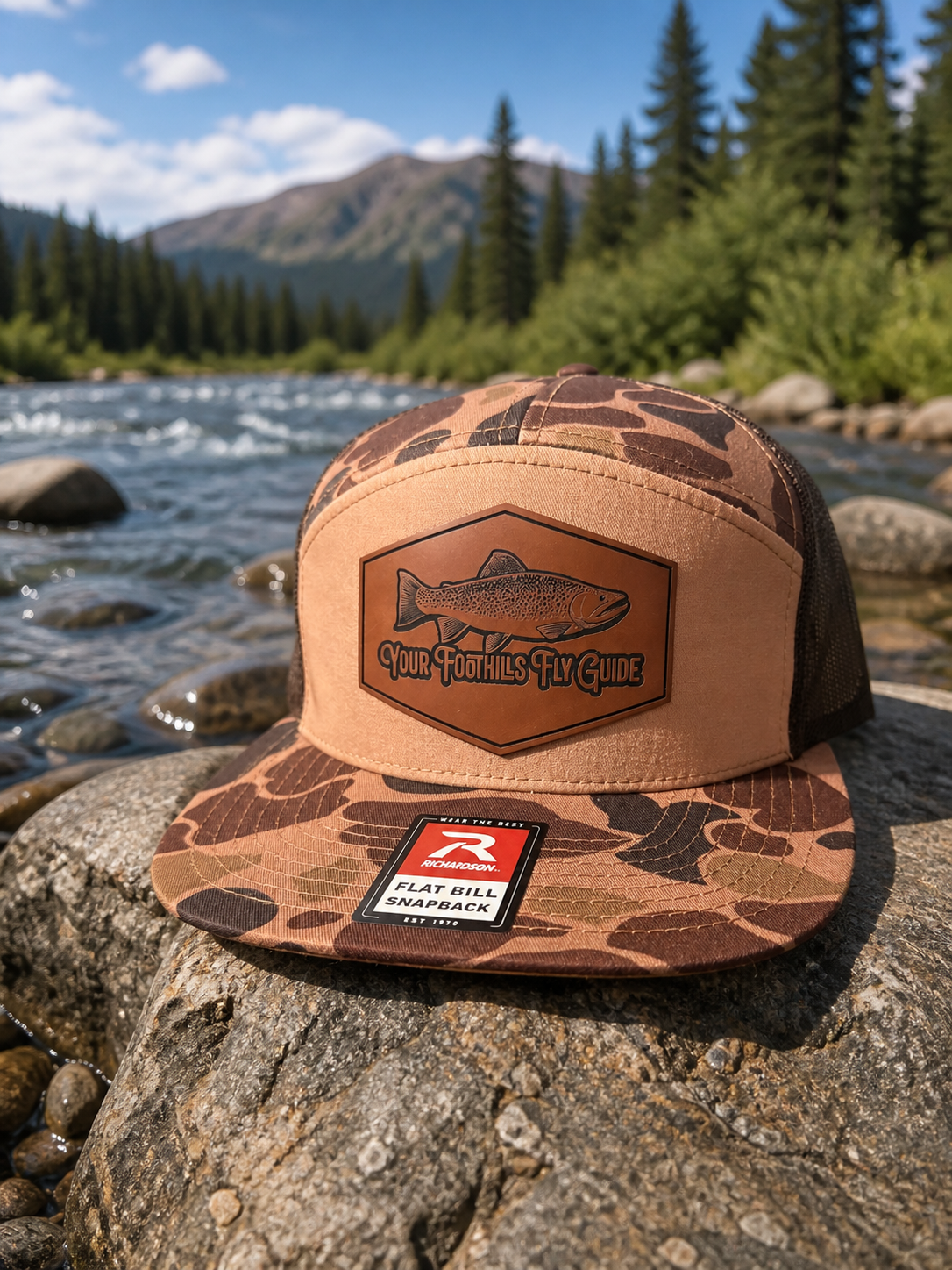 Foothills Fly Guide leather patch on camo flat bill snapback hat